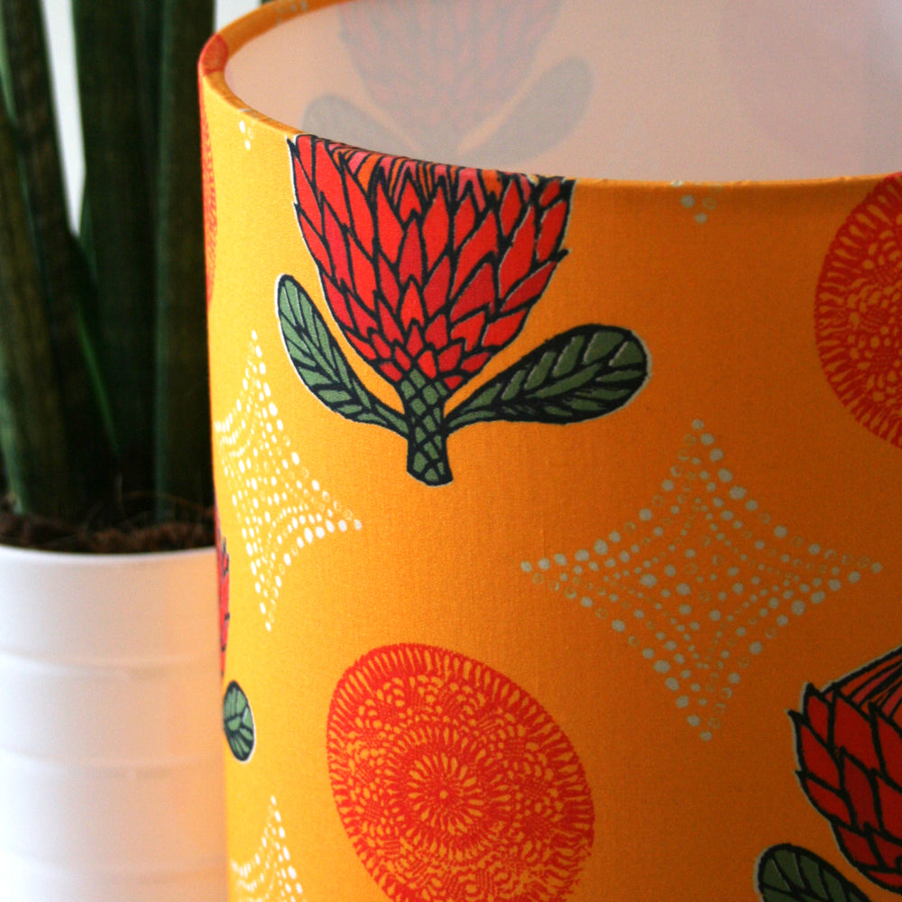 orange lampshade with red flowers and white diamonds