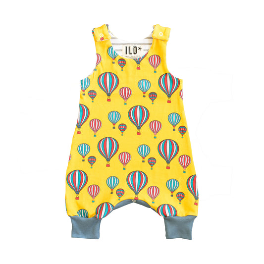 yellow balloon print romper with blue trim 