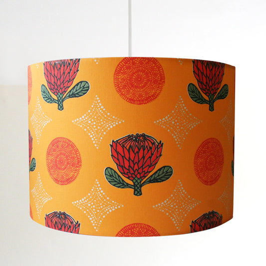 orange lampshade with red flowers and white diamonds