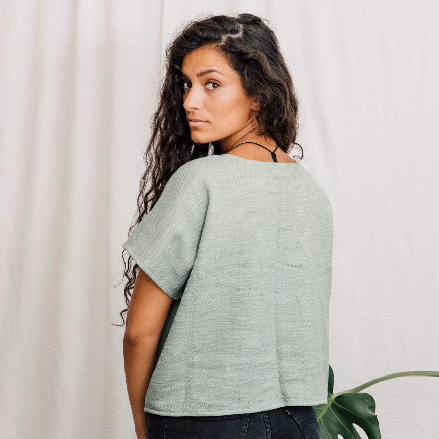 back of lady wearing green top