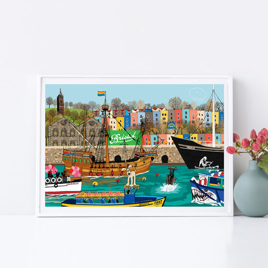 colourful bristol houses with boats on water 