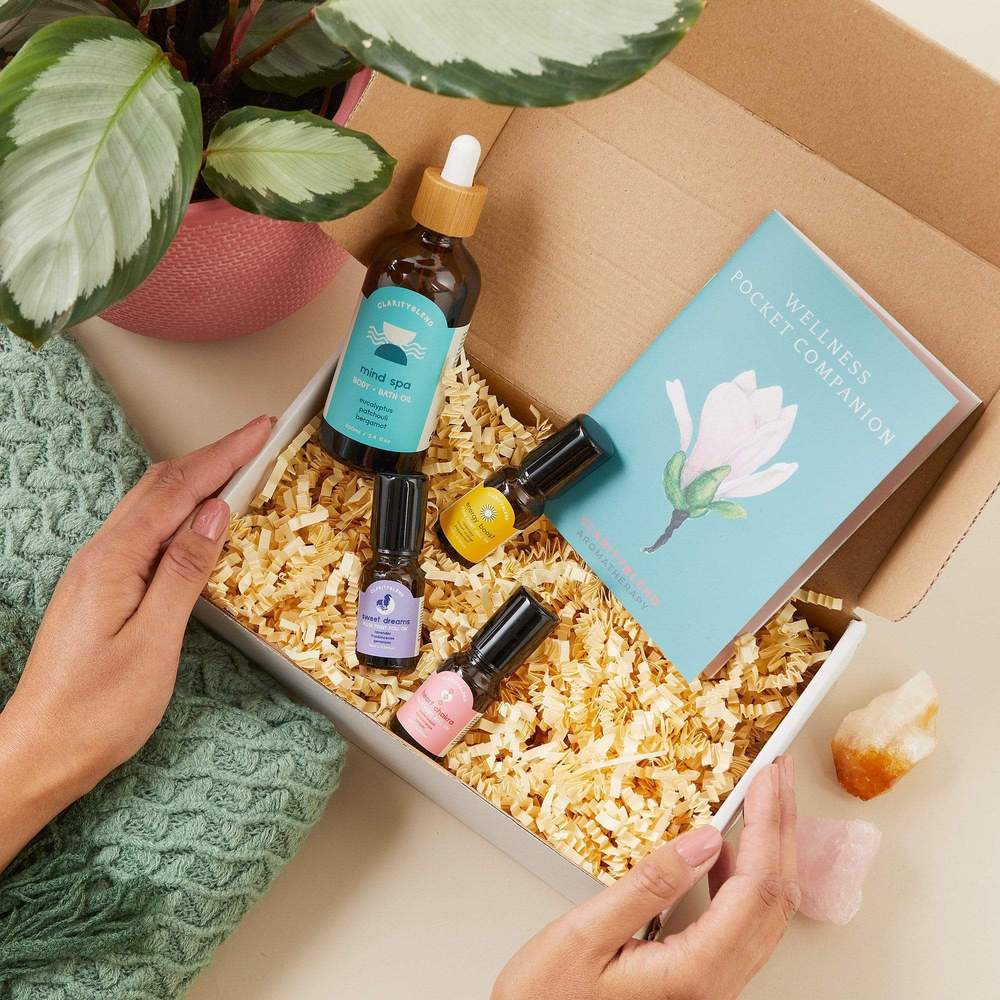 self care box with bottles of pulse point rolls ons and body oil 