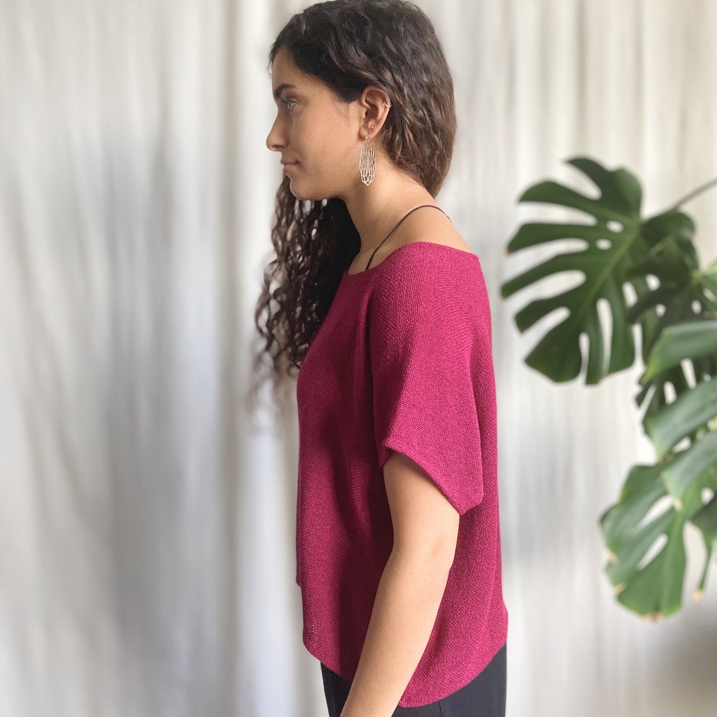 side view of lady wearing pink top